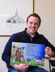 Tom Wall with an illustration of St. Francis of Assisi and the Prayer of St. Francis. He made the poster as a Christmas gift for his niece and nephews and now plans to create a Catholic children’s book of prayers. Photo credit: Sam Lucero, The Compass